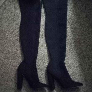 Thigh high heeled boots